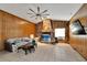 Living Room with stone fireplace and wood paneling at 11109 Sumner Rd, Wimauma, FL 33598