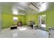 Bright green workshop with various items at 11109 Sumner Rd, Wimauma, FL 33598
