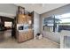 Small kitchen with wood cabinets, microwave, and window at 11109 Sumner Rd, Wimauma, FL 33598