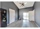 Primary bedroom with ceiling fan and sliding glass door at 11109 Sumner Rd, Wimauma, FL 33598