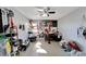 Bright bedroom with tiled floors, ample closet space, and a large window at 11109 Sumner Rd, Wimauma, FL 33598