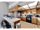 Galley kitchen, stainless steel appliances, and wood cabinets at 11109 Sumner Rd, Wimauma, FL 33598
