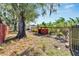 Spacious backyard with wooden fence and various plants at 11109 Sumner Rd, Wimauma, FL 33598
