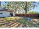 Large backyard with wooden fence and small pool at 11109 Sumner Rd, Wimauma, FL 33598