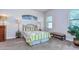 Cozy bedroom with carpet, window seat, and a leafy plant at 2727 Colewood Ln, Dover, FL 33527