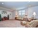 Spacious bonus room featuring comfortable seating and ample natural light at 2727 Colewood Ln, Dover, FL 33527