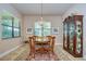 Charming breakfast nook features a wood table and display cabinet at 2727 Colewood Ln, Dover, FL 33527