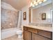 Updated bathroom with granite vanity and tile shower/tub at 2727 Colewood Ln, Dover, FL 33527