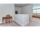 Upper level hallway with built-in desk and neutral decor at 2727 Colewood Ln, Dover, FL 33527