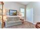 Home office with a comfortable couch and built-in shelving at 2727 Colewood Ln, Dover, FL 33527