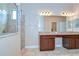 Spa-like bathroom with granite double vanity and glass enclosed shower at 2727 Colewood Ln, Dover, FL 33527