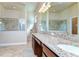 Elegant bathroom features granite double vanity and large glass shower at 2727 Colewood Ln, Dover, FL 33527