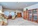 Bonus room with built-in shelving and comfortable seating area at 2727 Colewood Ln, Dover, FL 33527