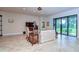 Comfortable living room with tile floors, sliding glass doors to backyard at 2727 Colewood Ln, Dover, FL 33527