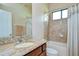 Bathroom with granite countertop, shower/tub combo, and tile flooring at 2727 Colewood Ln, Dover, FL 33527