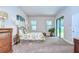 Primary bedroom with carpet flooring and sliding glass doors to patio at 2727 Colewood Ln, Dover, FL 33527