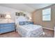 Charming bedroom with white headboard and blue accents at 2727 Colewood Ln, Dover, FL 33527