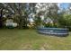 Large backyard with above ground pool and home in background at 12805 Flint Creek Rd, Thonotosassa, FL 33592