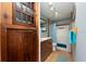 Bathroom with walk-in shower, tile floor and wood cabinet at 12805 Flint Creek Rd, Thonotosassa, FL 33592