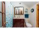 Clean bathroom with dark wood vanity and blue shower curtain at 12805 Flint Creek Rd, Thonotosassa, FL 33592