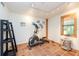 Home gym with elliptical machine and tile floors at 12805 Flint Creek Rd, Thonotosassa, FL 33592