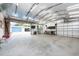 Spacious garage featuring ample storage and workbenches at 12805 Flint Creek Rd, Thonotosassa, FL 33592