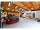 Well-lit garage featuring overhead lighting and car storage at 12805 Flint Creek Rd, Thonotosassa, FL 33592