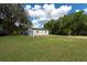 Detached garage with blue doors at 12805 Flint Creek Rd, Thonotosassa, FL 33592