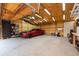 Well-lit garage featuring overhead lighting and car storage at 12805 Flint Creek Rd, Thonotosassa, FL 33592
