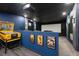 Home theater with large screen, comfy seating, and game at 12805 Flint Creek Rd, Thonotosassa, FL 33592