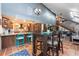 Open kitchen features granite counters and breakfast bar with teal stools at 12805 Flint Creek Rd, Thonotosassa, FL 33592