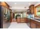 Kitchen with granite countertops, stainless steel appliances, and an island at 12805 Flint Creek Rd, Thonotosassa, FL 33592