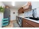 Laundry room with washer, dryer, and lots of storage at 12805 Flint Creek Rd, Thonotosassa, FL 33592