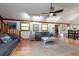 Bright living room with vaulted ceiling and comfy seating at 12805 Flint Creek Rd, Thonotosassa, FL 33592