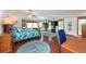 Spacious main bedroom with hardwood floors, large windows, and a ceiling fan at 12805 Flint Creek Rd, Thonotosassa, FL 33592