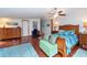 Main bedroom with hardwood floors and ample wood furniture at 12805 Flint Creek Rd, Thonotosassa, FL 33592