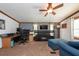 Home office with built-in desk and comfortable seating at 12805 Flint Creek Rd, Thonotosassa, FL 33592