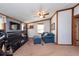 Bright office features a comfy couch and large TV at 12805 Flint Creek Rd, Thonotosassa, FL 33592