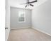 Light and airy bedroom features carpet flooring, ceiling fan and window at 12820 Belvedere Song Way, Riverview, FL 33578
