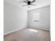 Bedroom featuring a carpeted floor, ceiling fan and a bright window with blinds at 12820 Belvedere Song Way, Riverview, FL 33578