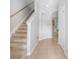 Hallway featuring tile floors and a staircase to the second level at 12820 Belvedere Song Way, Riverview, FL 33578