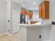 Eat-in kitchen with white counter and view of stainless fridge and cabinets at 12820 Belvedere Song Way, Riverview, FL 33578