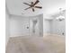 Spacious open-concept living room and dining area with modern lighting and tiled floors at 12820 Belvedere Song Way, Riverview, FL 33578