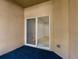 View from patio featuring carpet flooring, stucco wall and sliding door to bedroom at 12820 Belvedere Song Way, Riverview, FL 33578