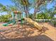 Community playground features a large play structure with slides, climbing areas, and shaded seating at 12820 Belvedere Song Way, Riverview, FL 33578