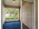 Enclosed porch featuring carpet flooring and a view of the backyard at 12820 Belvedere Song Way, Riverview, FL 33578