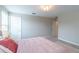 Cozy bedroom with a queen bed and access to a private bathroom at 3138 Hilliard Dr, Wesley Chapel, FL 33543