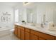 Bright bathroom with double vanity, soaking tub, and separate shower at 4206 Branchside Ln, Wesley Chapel, FL 33543