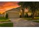 Inviting one-story home featuring a well-maintained lawn, neutral paint, and attached two-car garage at 4206 Branchside Ln, Wesley Chapel, FL 33543