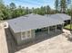 Aerial view of the rear and roof showing backyard and patio at 4729 Majestic Hills Loop, Brooksville, FL 34601